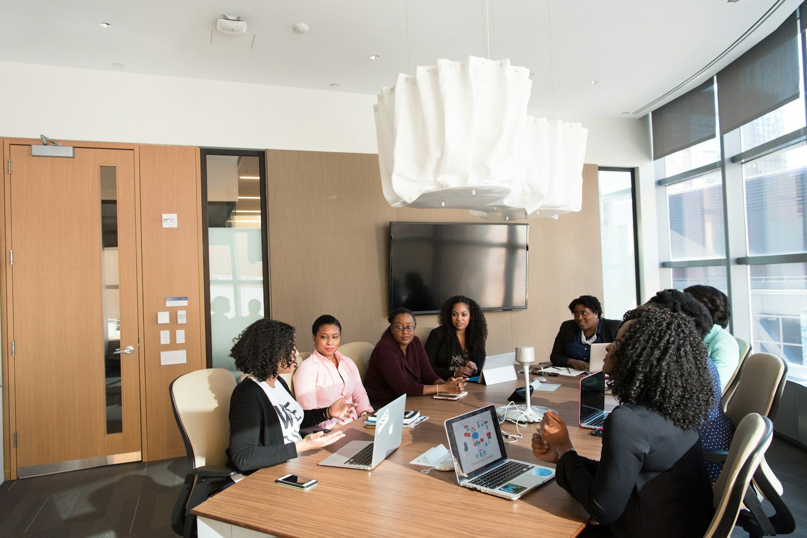 Diverse professionals collaborating in a natural-light office