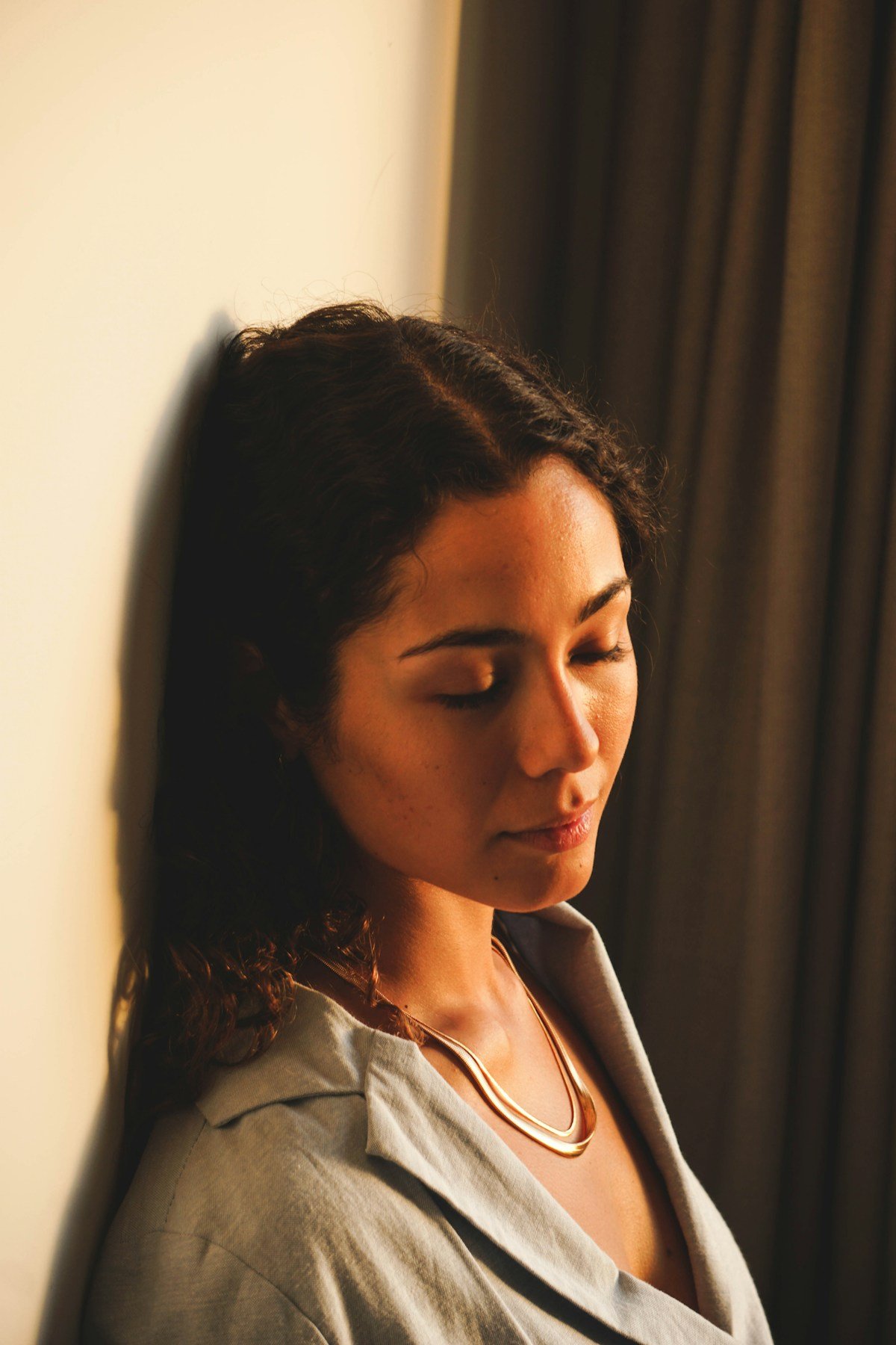 Thoughtful woman founder in natural light